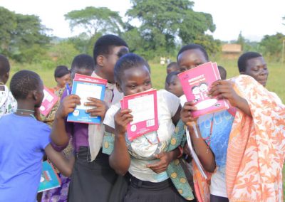 Impact Nations Children Getting Educational Brocures in Africa
